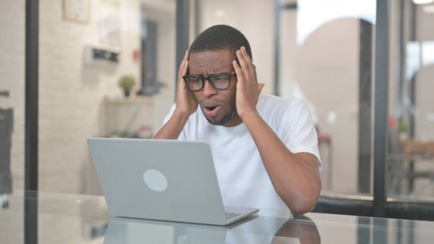 istock African American Man Shocked by Failure on Laptop 2140000306
