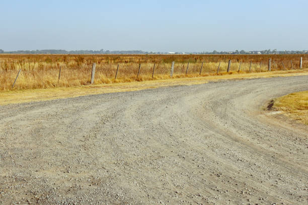 curving gravel road in dry summer fields  in outer western suburban Melbourne