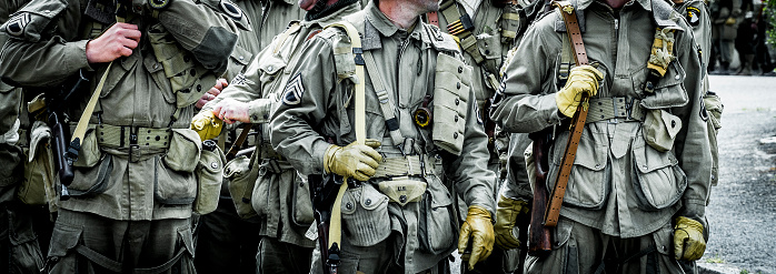 Second world war commemoration. Military camp reconstitution. Unidentified armed troop soldiers walking after liberation