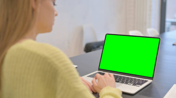 istock Woman Working on Laptop with Green Screen Chroma Key 2140043514