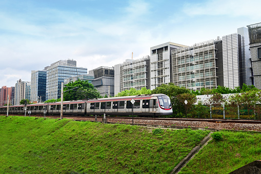 MTR Train and The Hong Kong Science and Technology Parks Corporation (HKSTP) in Pak Shek Kok, Hong Kong - 04/04/2024 16:59:54 +0000.