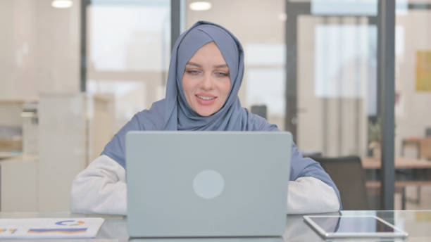 istock Arab Woman Doing Video Chat in Office 2140055267