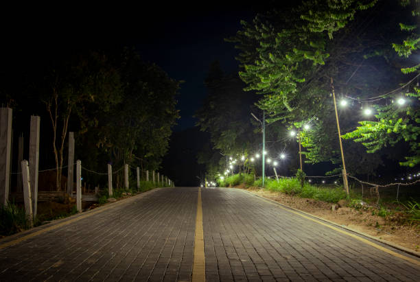 istock brick road with light bulbs at night 2140057951