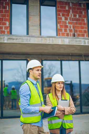 Two architects at a construction site