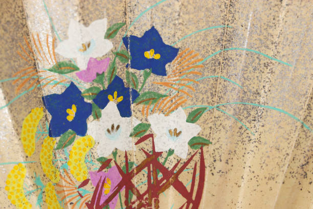 istock Japanese retro fan texture with a silver foil blizzard pattern on a basket with white and blue bellflower flowers. 2140146549