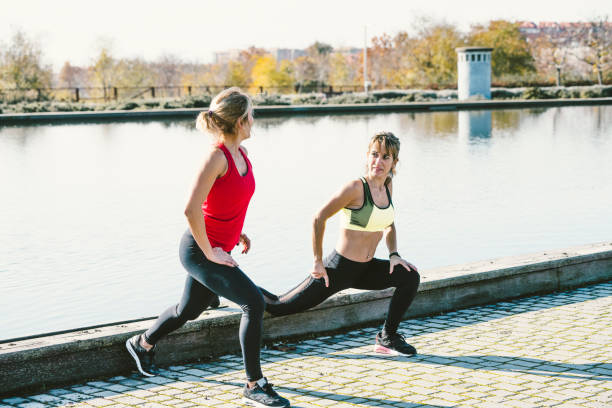 istock Two women who stretch in the park 2140167479