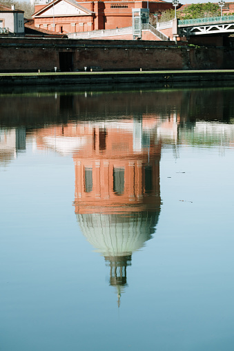 Dome de la Grave reflected on the Garonne river, Toulouse, France