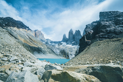 majestic rock formation behind base of the towers plateau in Torres del Paine national park - Chile