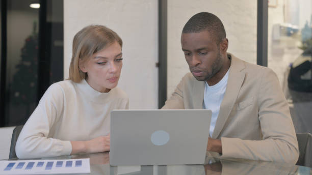 istock Multi Ethnic People Working on Laptop in Office 2140176682