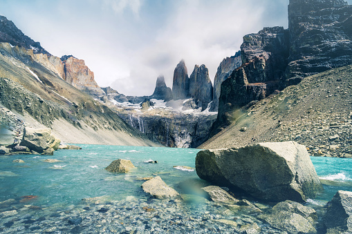 majestic rock formation behind base of the towers plateau in Torres del Paine national park - Chile