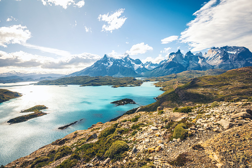 high angle view on lake pehoe in front of majestic panorama of Mountain range in Torres del Paine national park, Patagonia-Chile