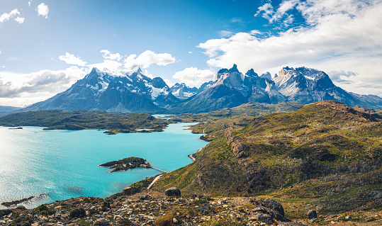 high angle view on lake pehoe in front of majestic panorama of Mountain range in Torres del Paine national park, Patagonia-Chile, stitches image