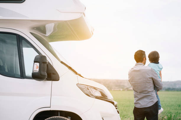 istock Father and son with the holiday caravan 2140194938
