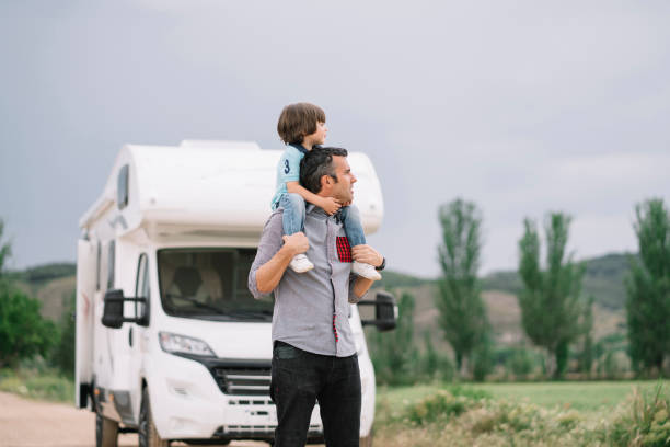 istock Father and son with the holiday caravan 2140195493