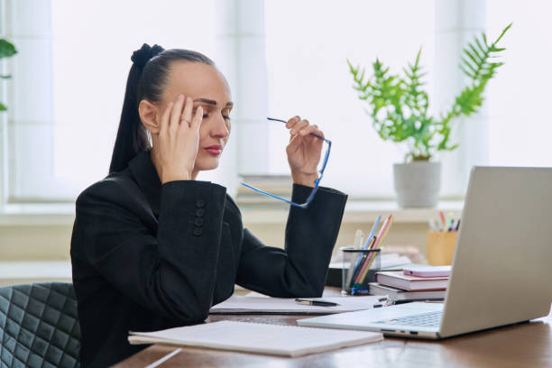 istock Tired sad business woman at the workplace 2140212366