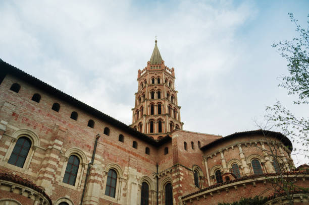 Stone and brick bell tower with two bells of the church  Parroquia de Nuestra Señora del Buen Consejo y San Anton. Puerto Lapice, a picturesque village in the route of Don Quixote, province of Ciudad Real, Castilla La Mancha, Spain, Europe