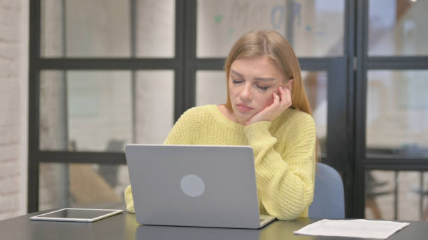 istock Sleeping Casual Creative Woman Sitting in Office 2140243388
