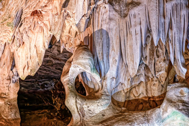 Head shaped rock in limestone cave and stalactites in the large underground limestone Cango Caves near Oudtshoorn, Western Cape South Africa