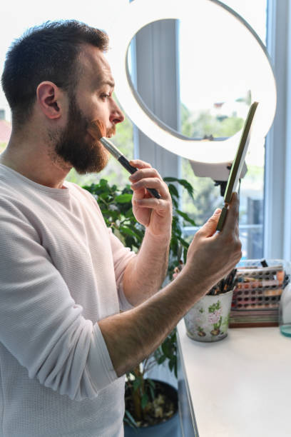 istock Modern Metrosexual Male Brushing Beard With Make Up Brush 2140273610