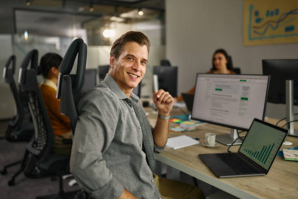 istock Happy male web designer working in the office. 2140280651