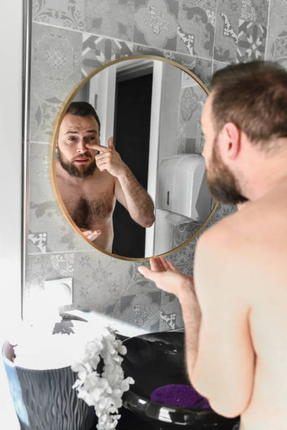 istock Anti Aging Cream Applied By Male Before Washing Face 2140280690