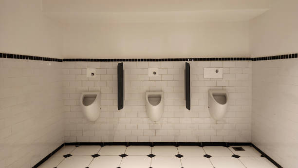istock Empty male toilet with warm light 2140297094