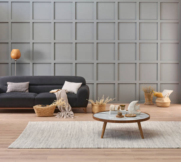 istock Grey room decorative wall background, dark blue sofa, middle table, blanket pillow style, vase of cotton flower and carpet, orange lamp, interior decoration. 2140301322