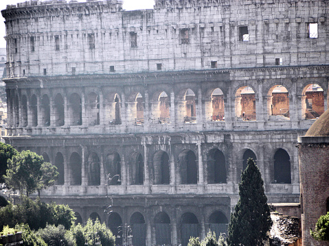 Rome, Italy, August, 12, 2010. The exteriors of the Colosseum. The Colosseum, originally known as the Flavian Amphitheater or simply Amphitheatrum, is the largest Roman amphitheater in the world (capable of holding an estimated number of spectators between 50,000 and 87,000), located in the center of the city of Rome. It is the most impressive monument of ancient Rome that has come down to us.