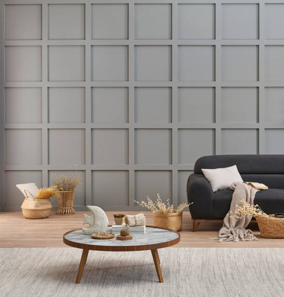 istock Grey room decorative wall background, dark blue sofa, middle table, blanket pillow style, vase of cotton flower and carpet, orange lamp, interior decoration. 2140302932