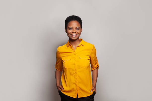 istock Confident successful woman smiling and having fun against studio wall banner background 2140308423