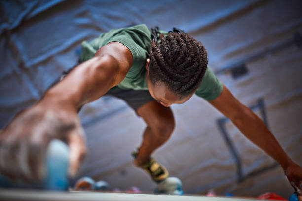 istock Close Up Of Determined Man Tackling Climbing Wall At Indoor Activity Centre 2140311138
