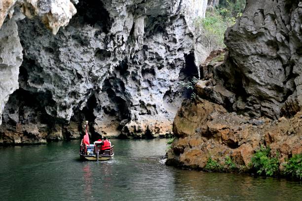 istock Boat passes through the karst cave 2140324526