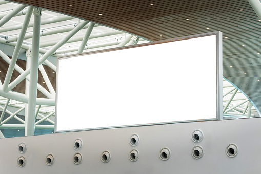 Blank billboard signboard in the airport, advertising mockup for ad placement advertising in the building
