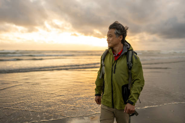 Elderly Asian Hiker at the Beach