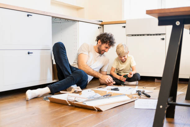 istock Father and son assembling kitchen furniture 2140377158