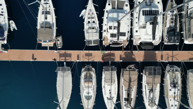 Aerial view of the yacht club. Aerial top-down view of docked sailboats. stock video