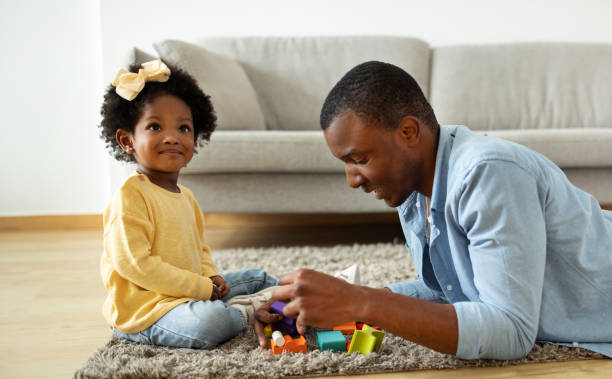 istock Loving Dad Enjoying Making Development Activities With Toddler Child Daughter 2140404860