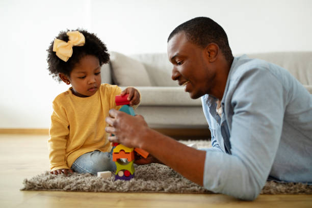 istock African american father spending time with his cute little daughter 2140404868