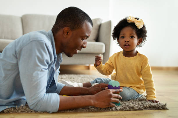 istock Loving african american dad enjoying game with daughter 2140404869