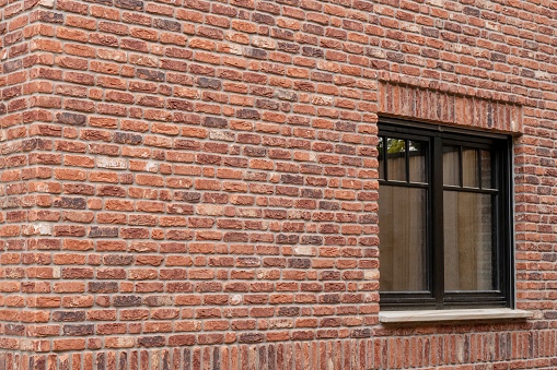 old brick wall with windows