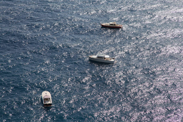 Boat yatch at the oceanic sea from a bird's eye view.