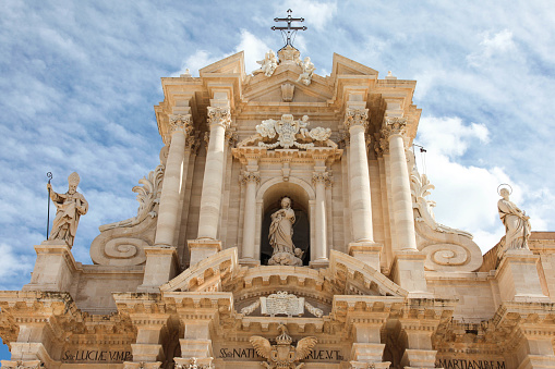 Baroque facade of The Cathedral of Syracuse (Duomo di Siracusa), formally the Cattedrale metropolitana della Nativita di Maria Santissima. Sicily, Italy.