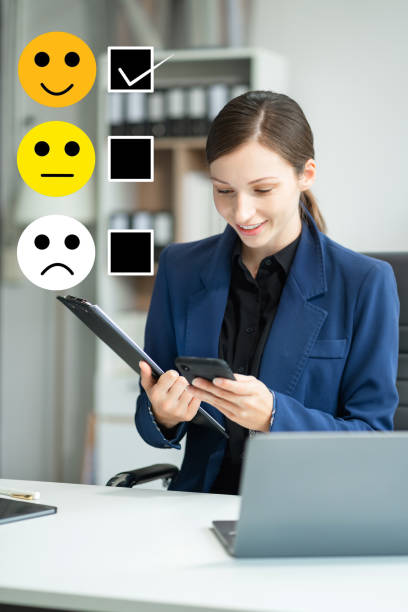 istock Happy Client customer experience concept. Woman recording phone inquiry with checkboxes, smiling face rating excellent for satisfaction survey. 2140412807