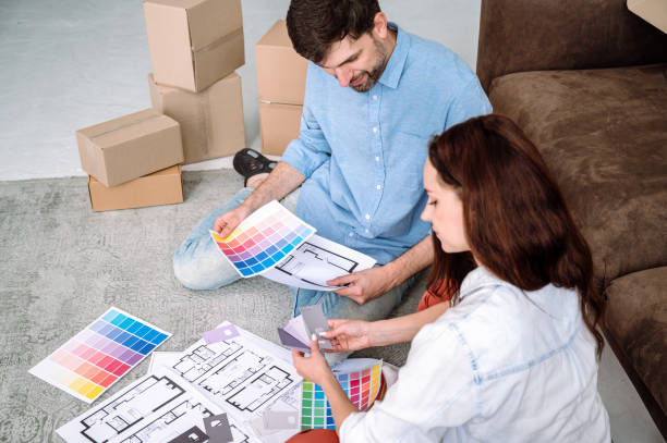 istock Young couple discussion about design interior at new apartment 2140418014