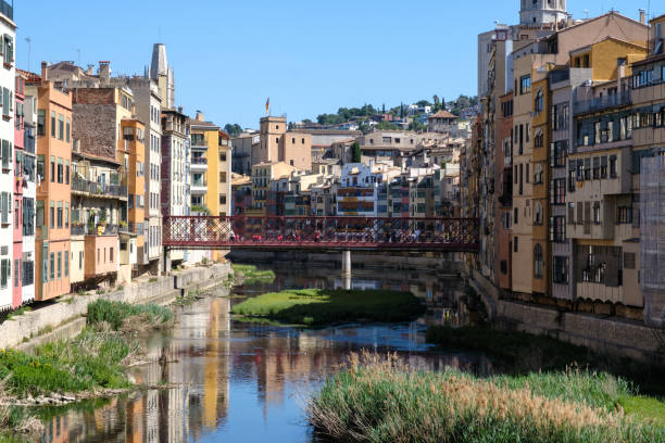 istock Colorful city buildings by a river 2140424097