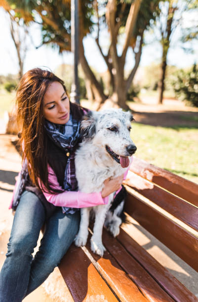 woman embracing her dog