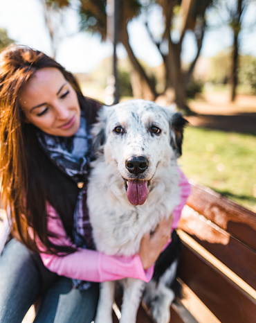 woman embracing her dog