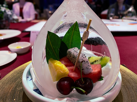 Tropical fruits in vertical ice decoration