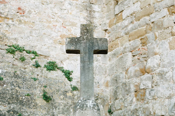 istock Christian cross made of stone 2140456813