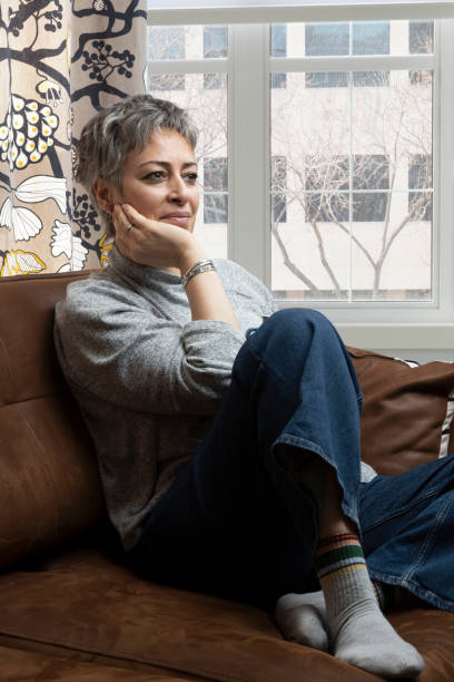 istock Thoughtful woman drinking a cup of coffee at home 2140485576